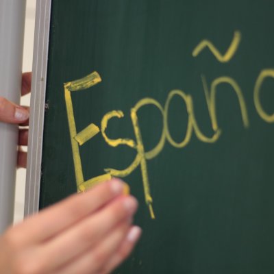 View of a board with Espanol written on it.