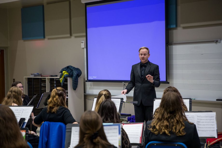 Instructor leading a group of music students