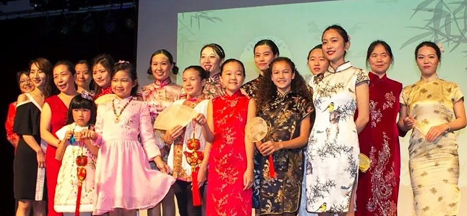 A group of participants on stage at a past China Night at South Dakota State University.