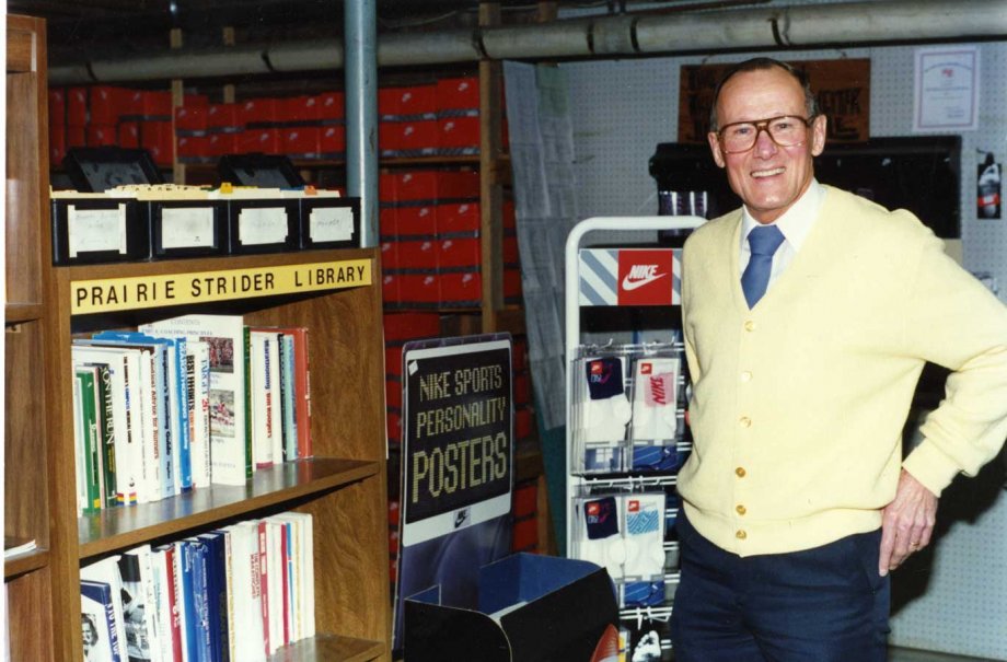 Bob Bartling in front of the Prairie Striders Library, which was housed in the basement of Bartling's Furniture Store, 1991