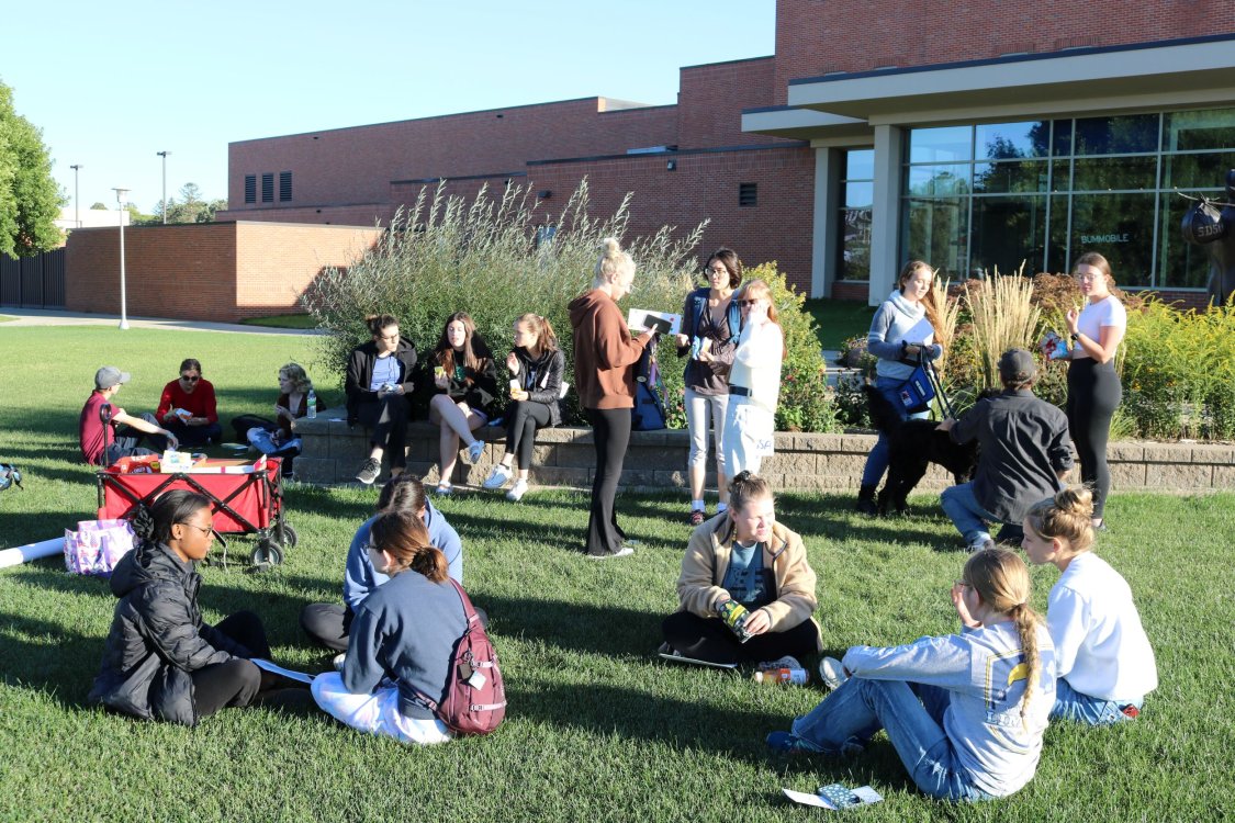 Students sitting outside the Student Union during First Year Fellowship