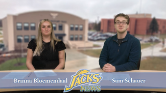 Two students delivering news stories on camera