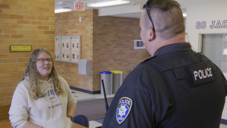 A female students speaks with a University Police Officer