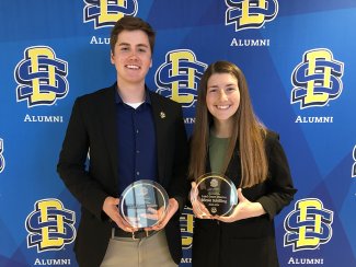 Hunter Eide and Nicole Schilling with their Land-grant Mission Awards. 